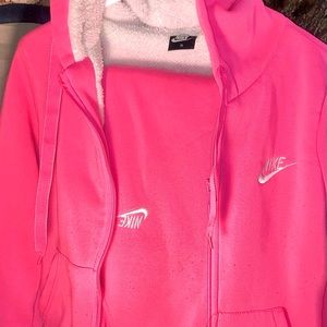 Hot pink Nike top and bottom warm ups.